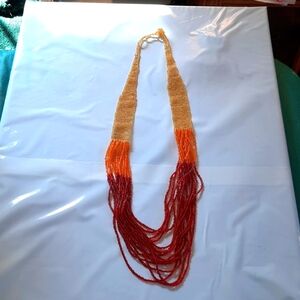 Long strand about 16 inches red, orange and yellow beautiful beaded necklace
